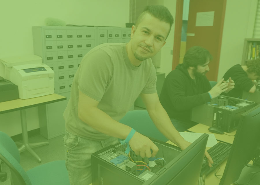Person working on the interior parts of a computer.