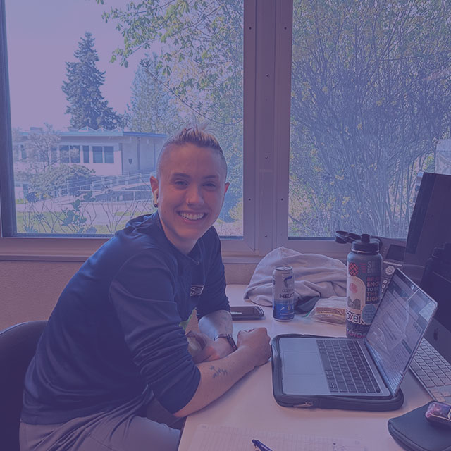 Woman at a desk with a computer