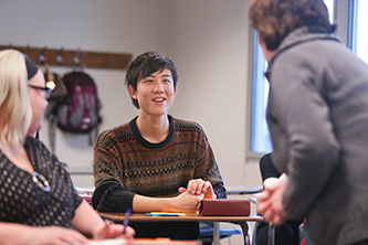 Photo of Highline College student in classroom learning English