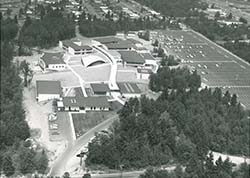 Black and white aerial photo of campus. Many of the buildings are different.
