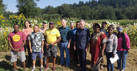 Photo of immigrant and refugee farmers with King County Executive Dow Constantine and project partners.