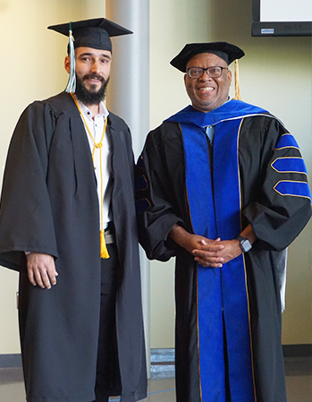 Highline College President John Mosby poses with a graduate at Commencement 2023.